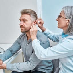 Man is fitted for hearing loss