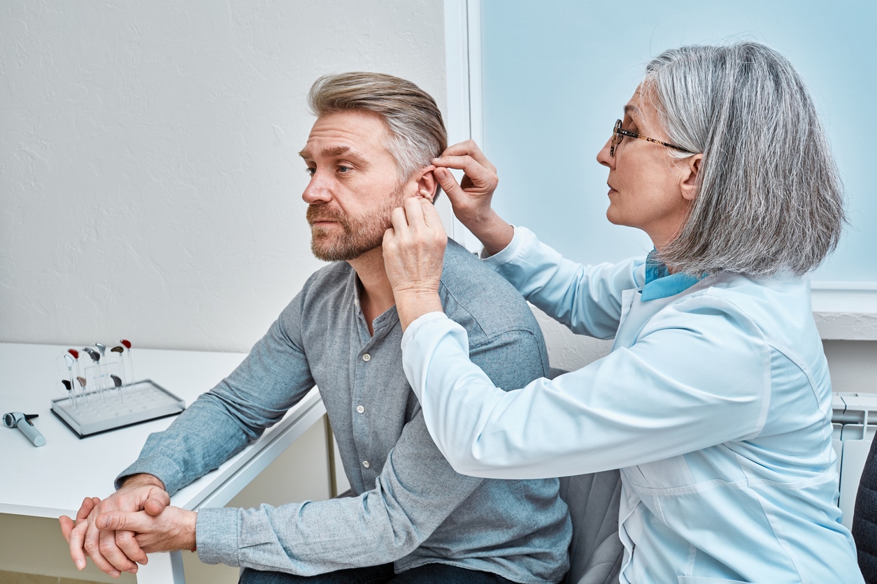 Man is fitted for hearing loss